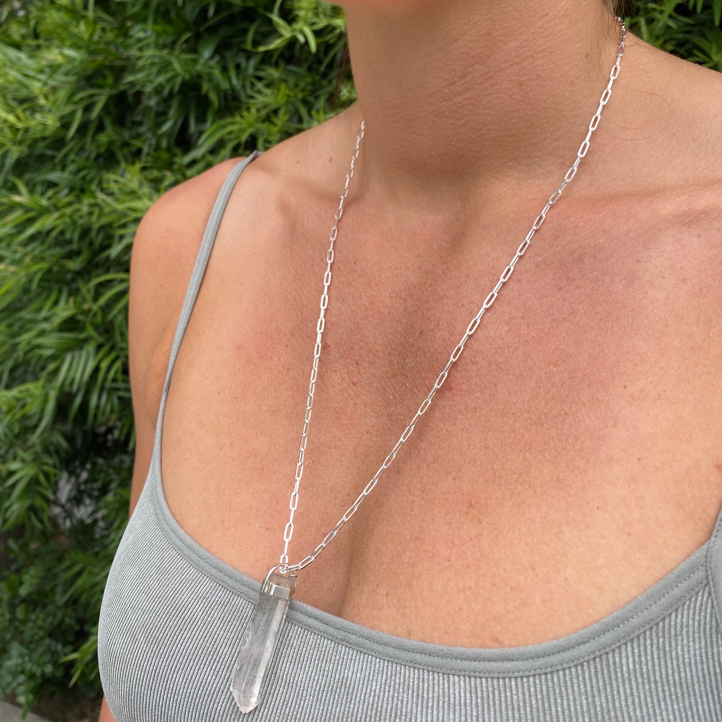 Raw, clear quartz pendant necklace with sterling silver chain. 24" necklace.
