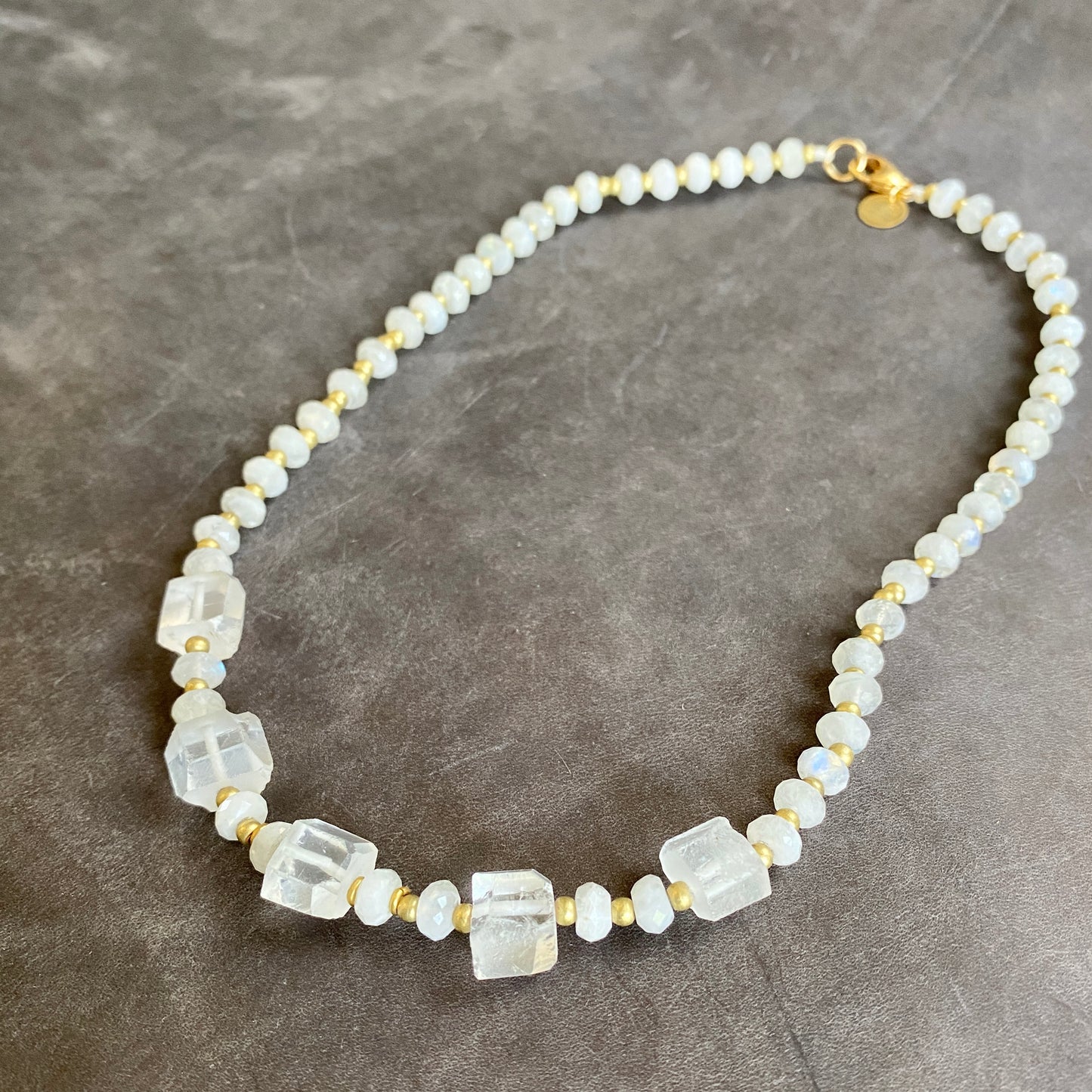 Moonstone, clear quartz gemstone necklace with African brass beads. 14k gold filled clasp. 20" necklace.