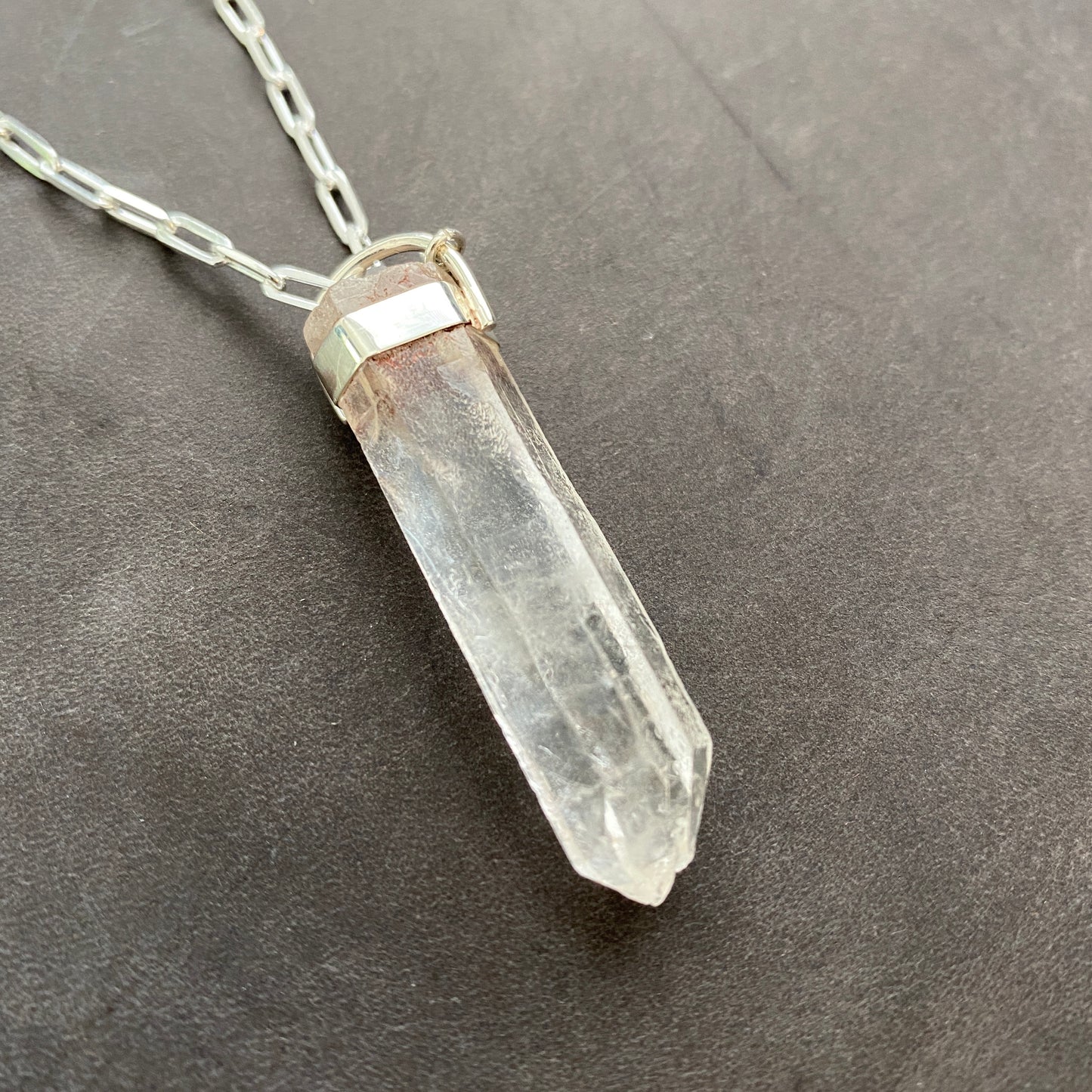 Raw, clear quartz pendant necklace with sterling silver chain. 24" necklace.