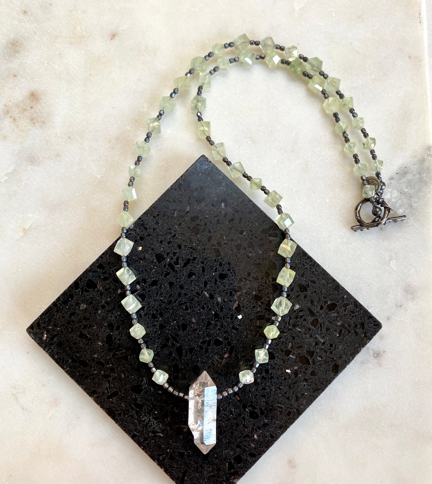 Green geometric prehnite gemstone necklace with Herkimer diamond pendant. 22.5" necklace.