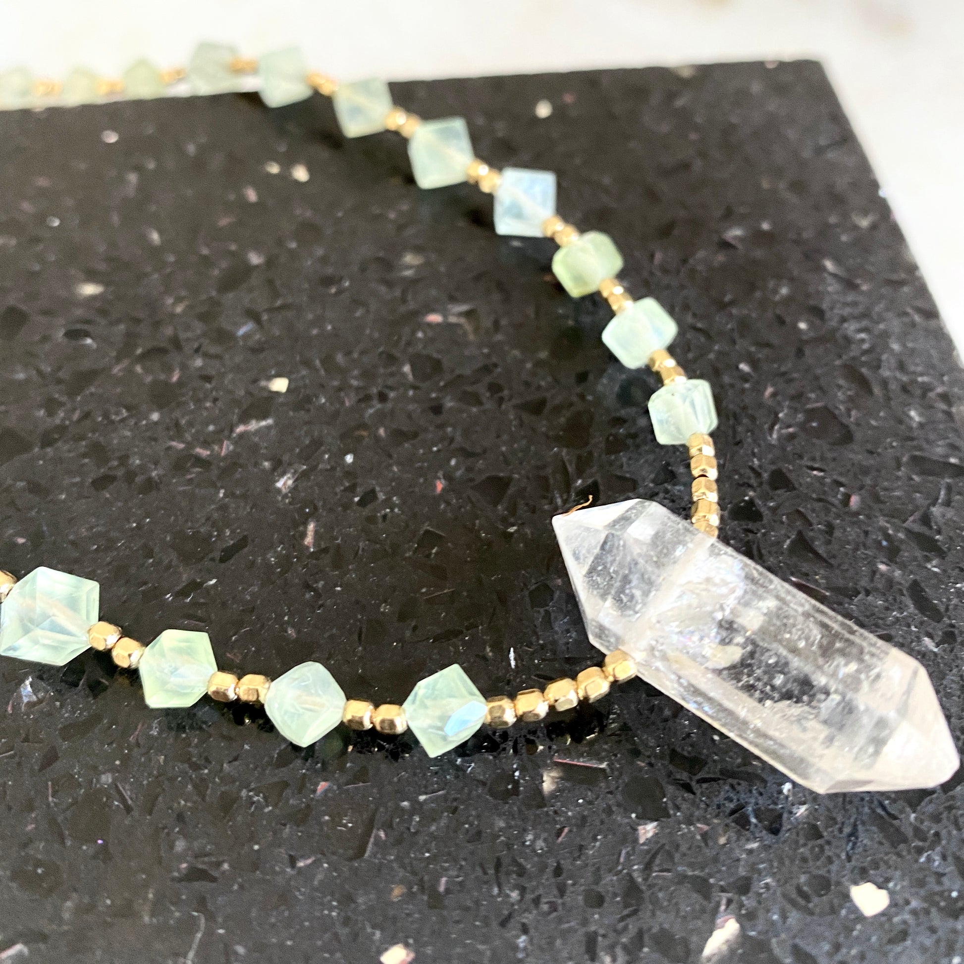 Green geometric prehnite gemstone necklace with Herkimer diamond pendant. 22.5" necklace with 14K gold toggle closure.
