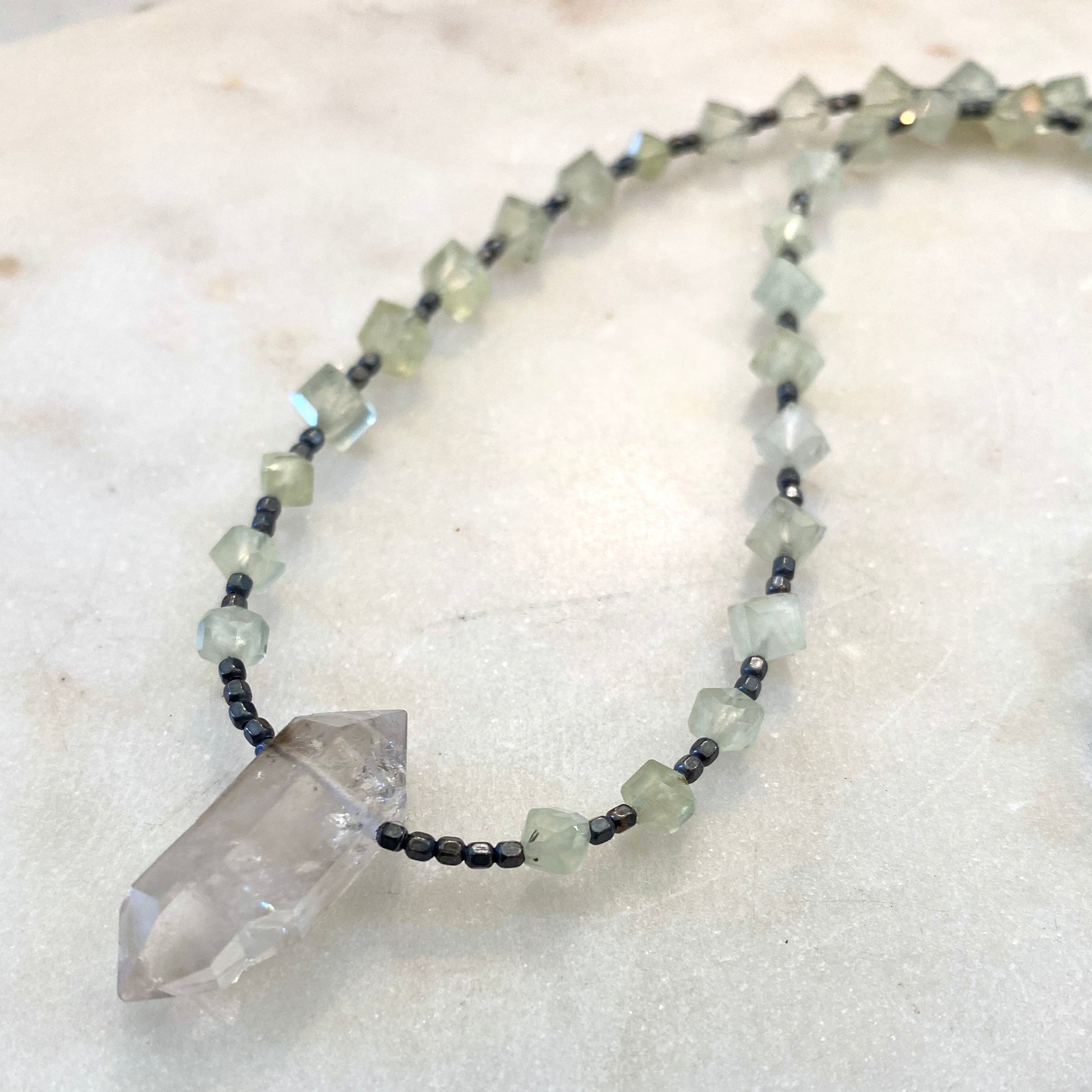 Green geometric prehnite gemstone necklace with Herkimer diamond pendant. 22.5" necklace.