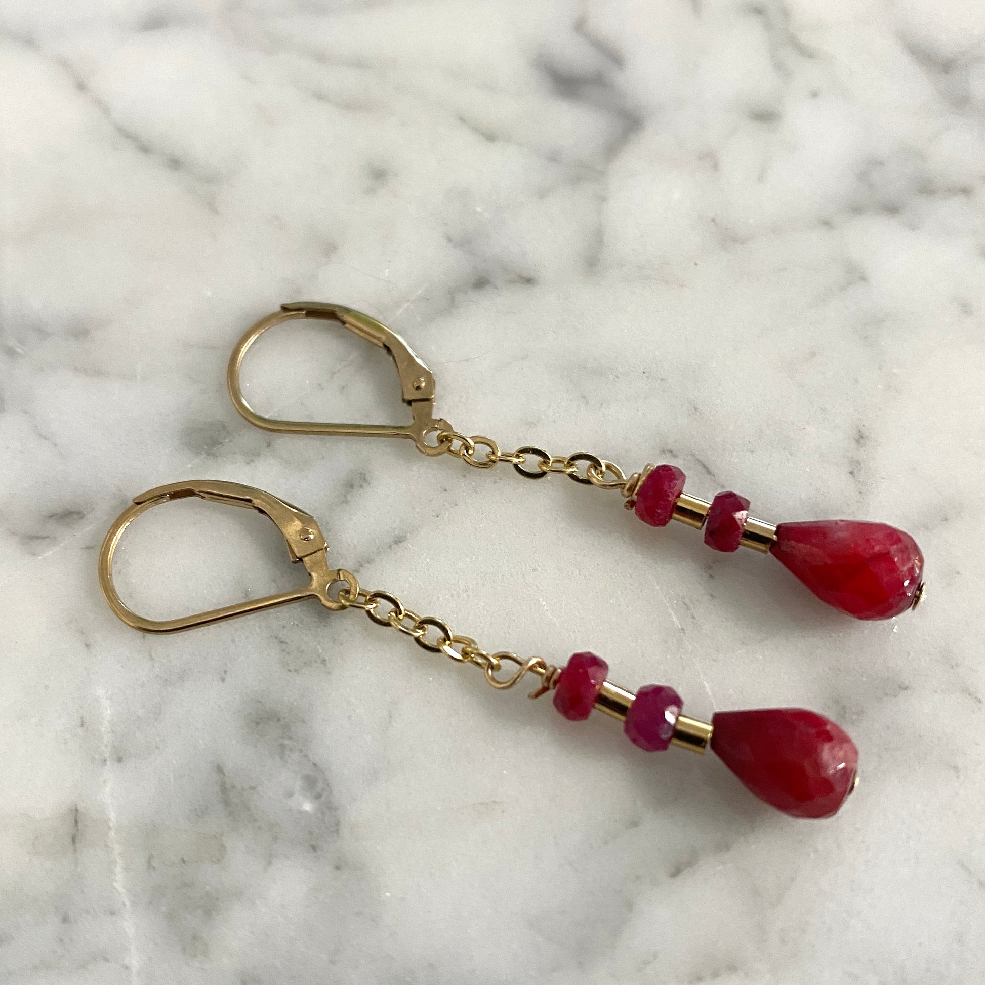 Natural ruby gold dangle earrings.